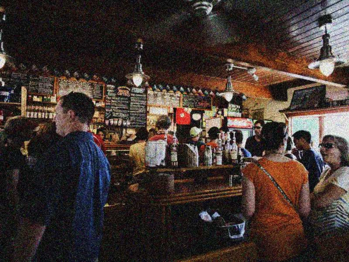 Grainy photo of a crowded bar at night, Before
